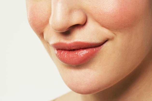 Young woman smiling, close-up
