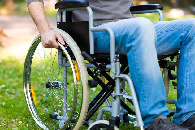 Paralyzed man using his wheelchair