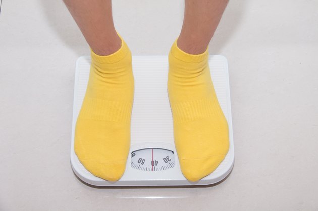 Closeup of a Asians weighed