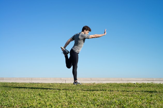 man stretches the body before running space for text