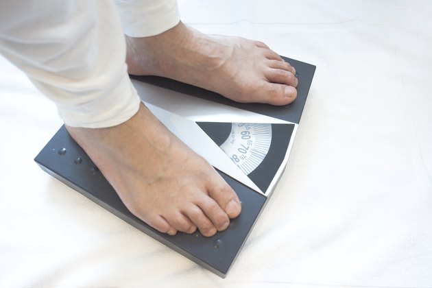 Man standing on weight scales