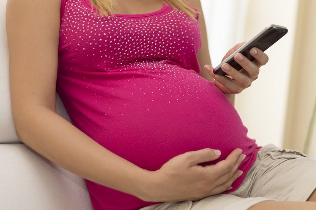 Pregnant woman with smart phone
