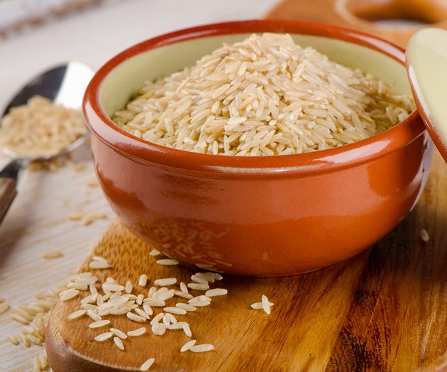 natural brown rice in bowl .