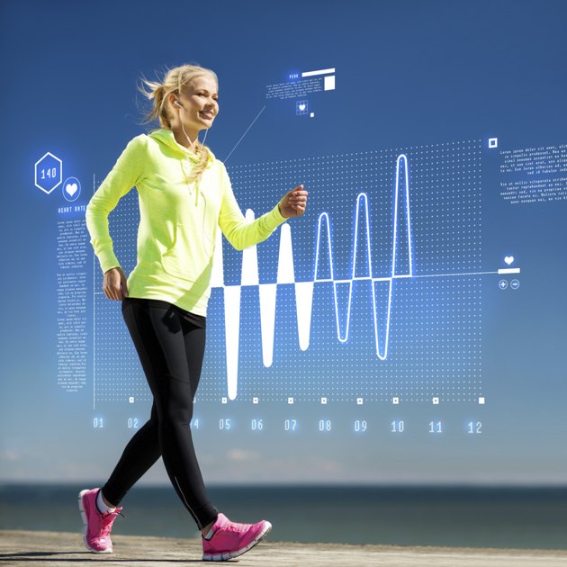 smiling woman doing sports outdoors with earphones