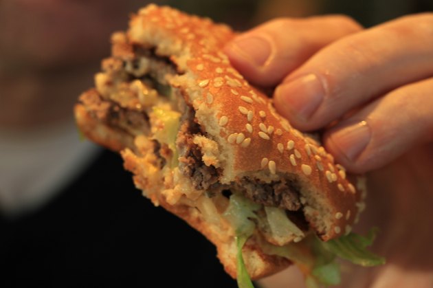 Man holding a hamburger