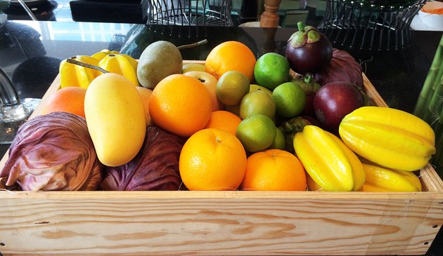Various types of fruit stored in wooden box