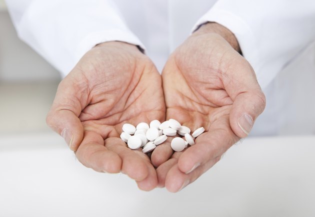 Doctor holding a pills in the hands