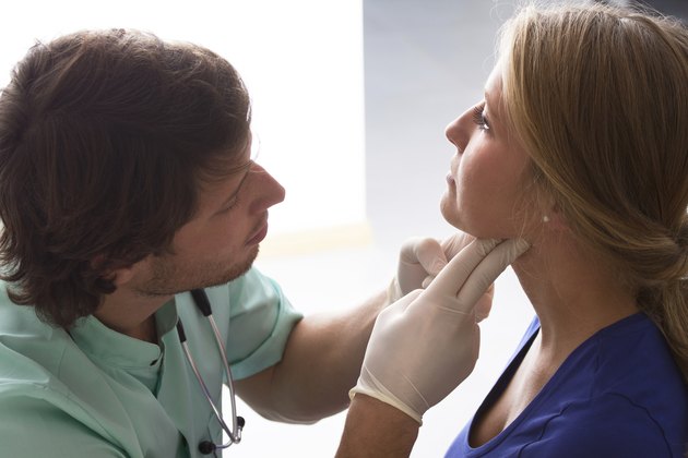 GP examining woman