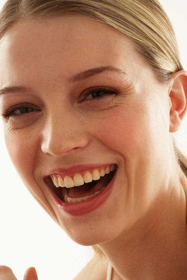Young woman smiling, portrait, close-up
