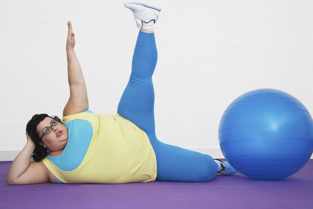 Overweight Woman Stretching Arm And Leg
