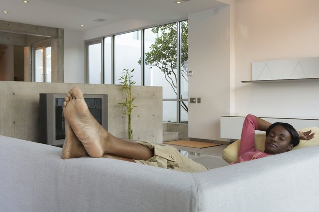 Young woman asleep on couch