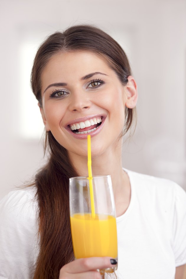 Women drinking orange juice