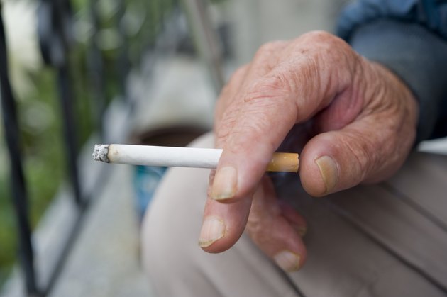 Holding Burning Cigarette