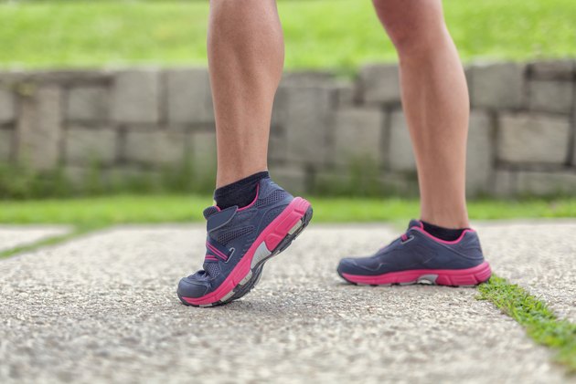closeup legs of female walker in park
