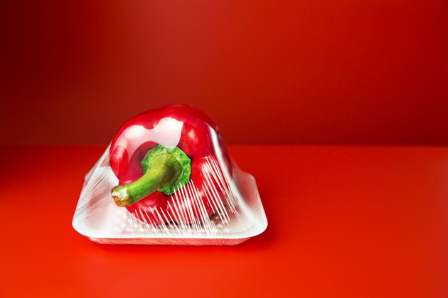 Close up of bell pepper shrink wrapped in plastic
