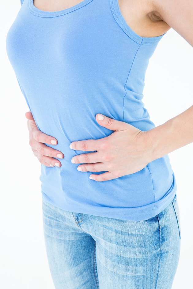 Woman suffering from stomach pain