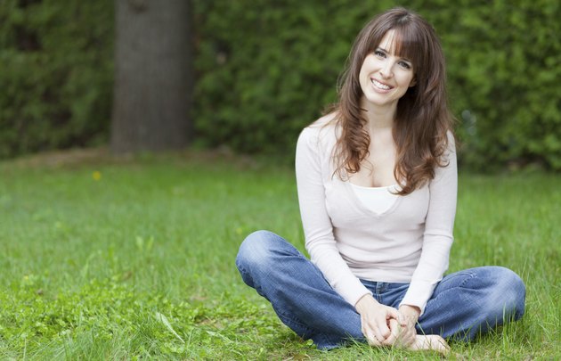 Serene Woman Relaxing At The Park