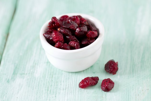 cranberry on wooden surface