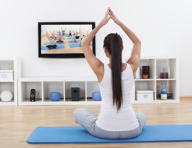 Spiritual woman meditating at home