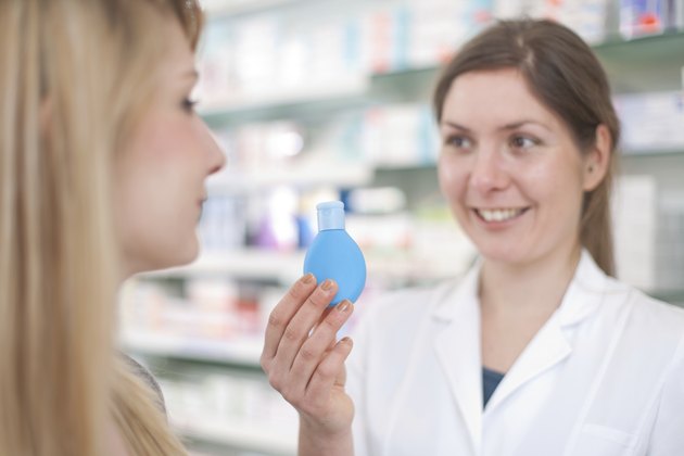 Pharmacist With Customer And Lotion