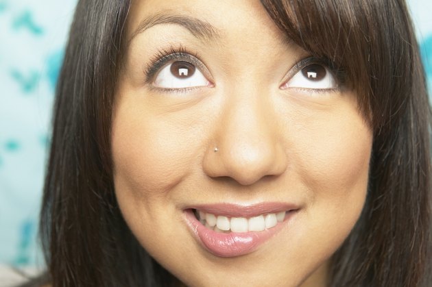 Close-up of a young woman looking up