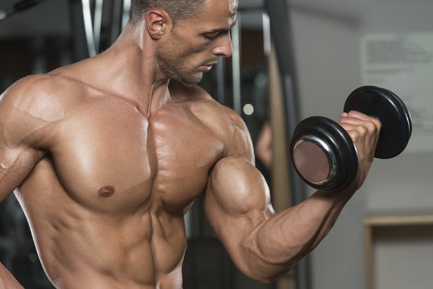 Young Man Working Out Biceps