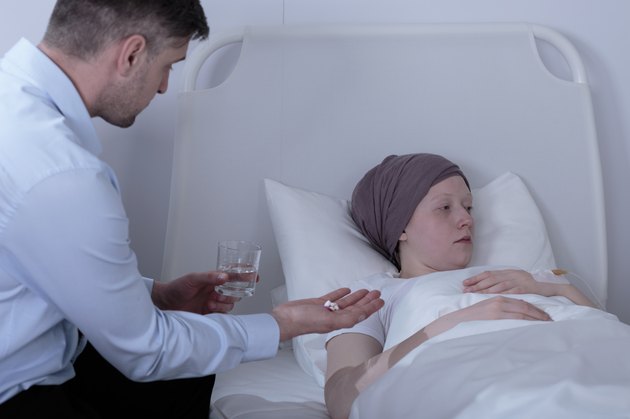 Father giving ill daughter medicines