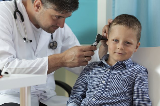 Boy during ear examination