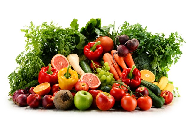 Variety of organic vegetables and fruits isolated on white