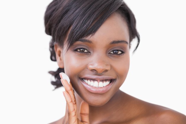 Woman applying face cream