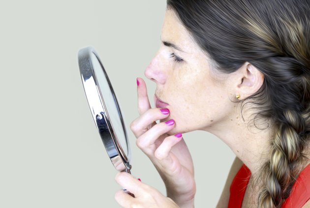 Checking herelf in the mirror
