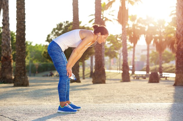 Tired woman resting after workout exercise
