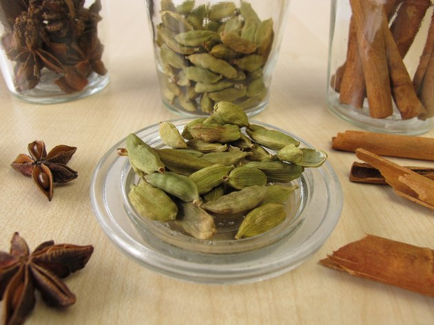 Spice jars with cardamom, cinnamon and star anise