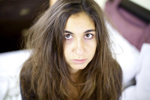 Sad and sick woman having really bad hair day