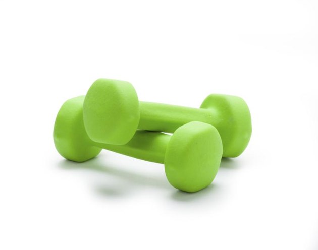 small green dumbbells, isolated in white background