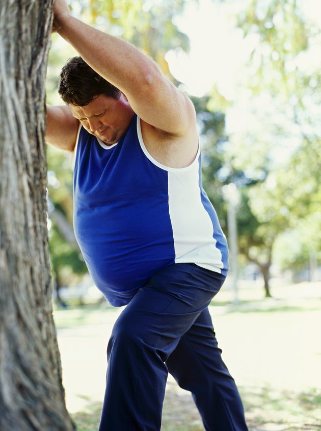side profile of a mid adult man exercising in a park