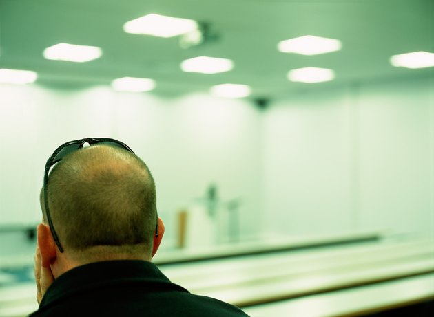 Man sits in empty auditorium