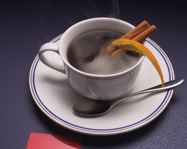 Coffee with Cinnamon Stick and Orange, High Angle View, Full Frame
