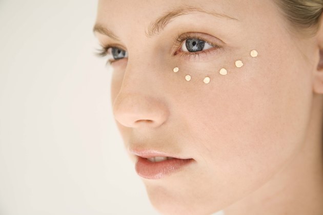 Woman with dots of moisturizer