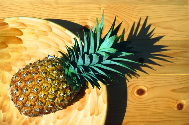 Pineapple in basket, directly above