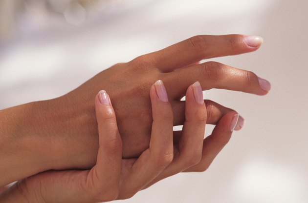 Woman caressing hands, close-up