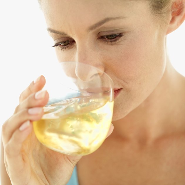 Close-up of a woman drinking from a glass