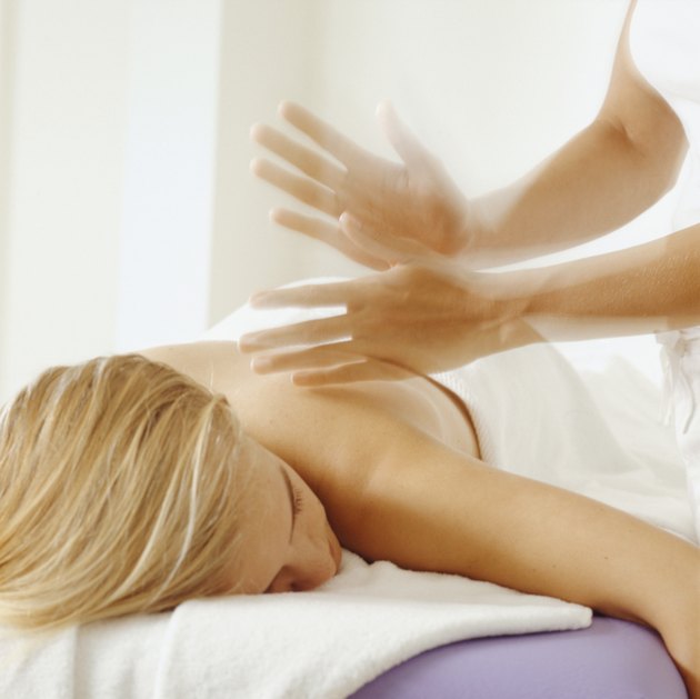 Young woman having back massage, close-up