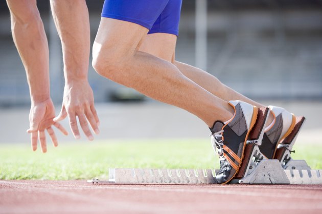 Athlete running out of starting blocks