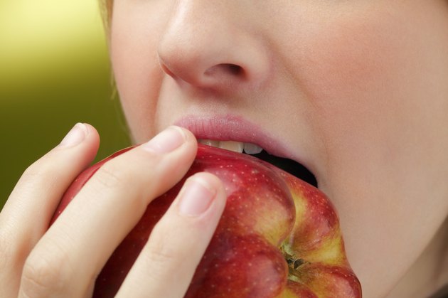 Woman eating apple