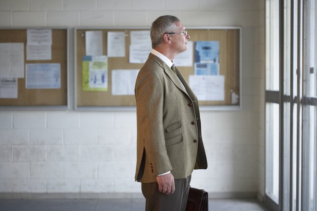 Mature man standing, side view