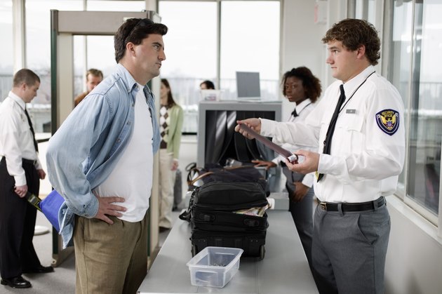 Security guard and man at airport