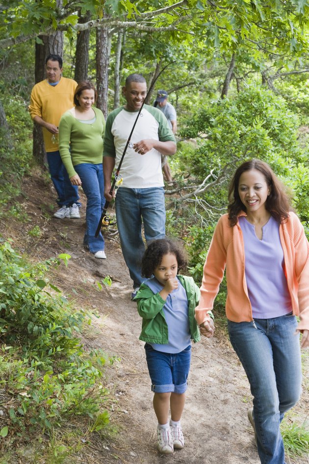 Family hiking on trail