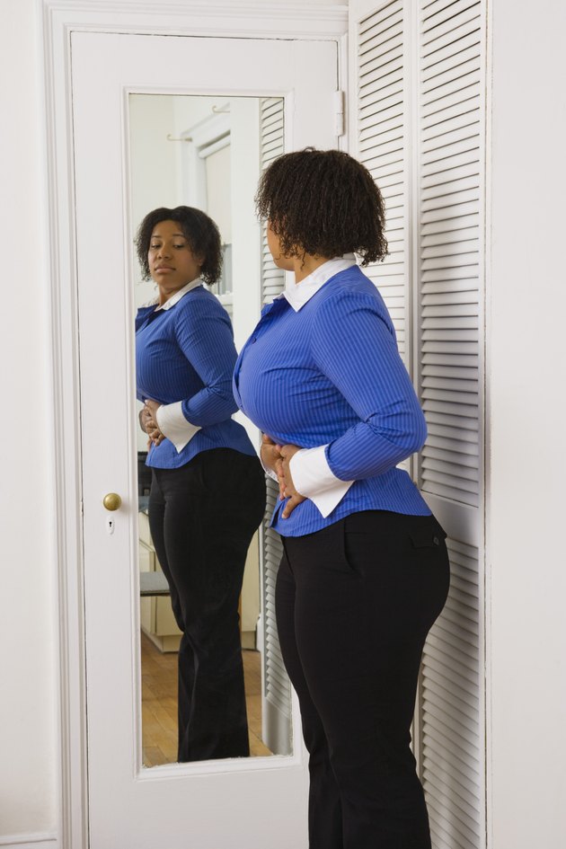 Woman looking in mirror