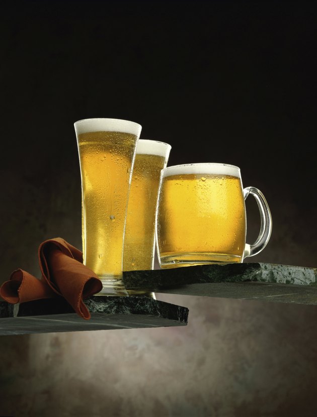 Two glasses and a mug of beer